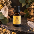 Air elemental essential oil diffuser blend in a 10 ml amber bottle styled with airy botanicals and ritual decor.