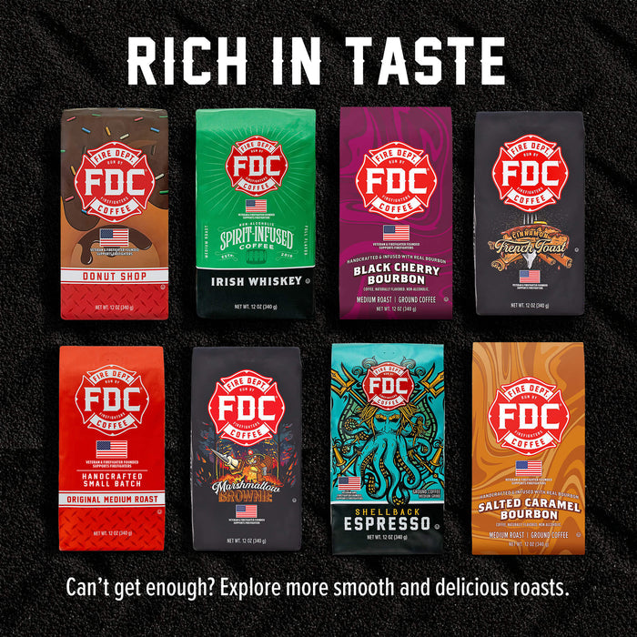 A promotional graphic showing eight FDC Artisan Coffee Roasted coffee bags arranged in a grid on a black textured background, with the headline 'RICH IN TASTE' at the top and the tagline 'Can't get enough? Explore more smooth and delicious roasts.' at the bottom.