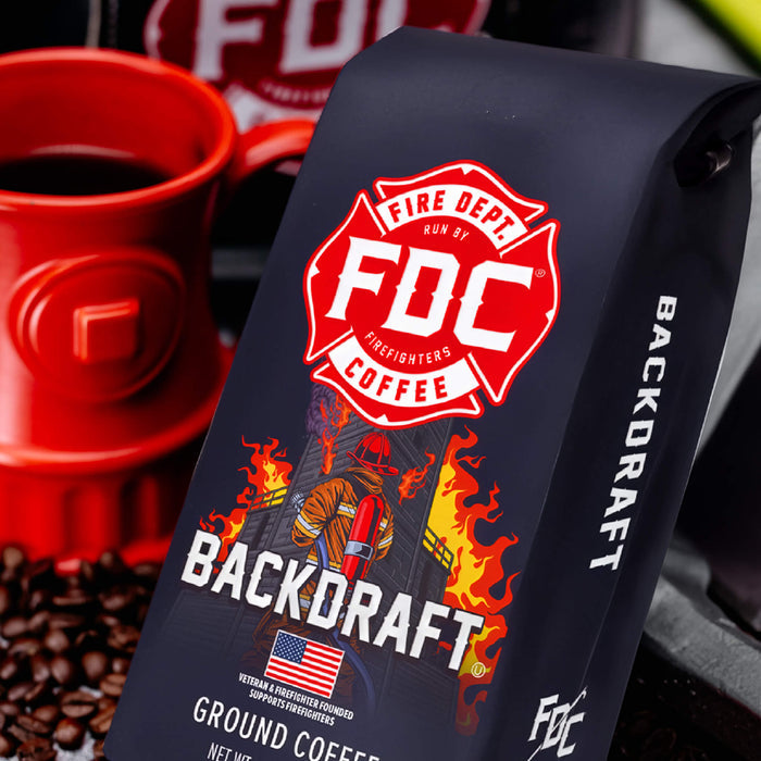 Fire Department Coffee 'Backdraft' package with a red cup and coffee beans in the background