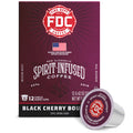 A box of FDC Fire Department Spirit-Infused Coffee in Black Cherry Bourbon flavor, shown alongside a single single-serve coffee capsule on a clean white background.