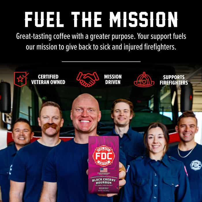 A promotional graphic for FDC Firefighters coffee featuring six firefighters in blue uniforms standing in front of a fire truck, with one man holding a purple bag of FDC Black Cherry Bourbon coffee. The top of the image has a black background with white text reading 'FUEL THE MISSION' and red icons for 'Certified Veteran Owned', 'Mission Driven', and 'Supports Firefighters'.