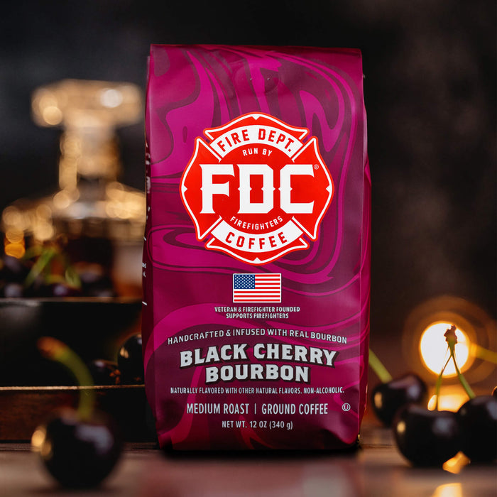 FDC Black Cherry Bourbon coffee bag with cherries in the foreground
