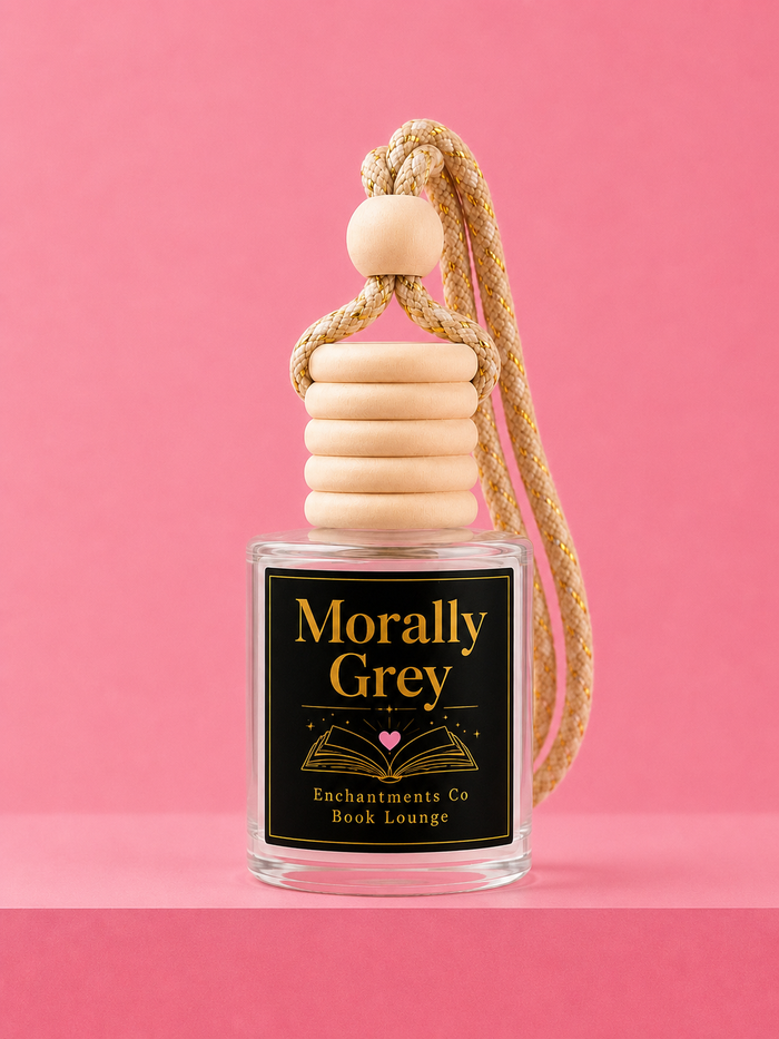 car freshner bottle with black label Morally Grey with a pink background.