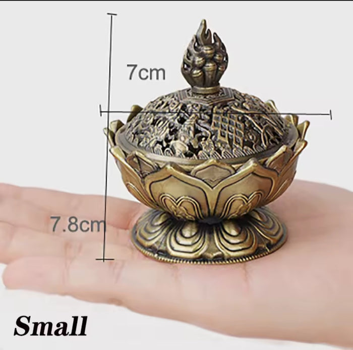 Bronze incense burner held in a hand with dimensions indicated