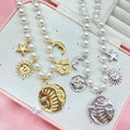 Collana in perle con elementi  astrali - Iride Shop - Accessori da Donna