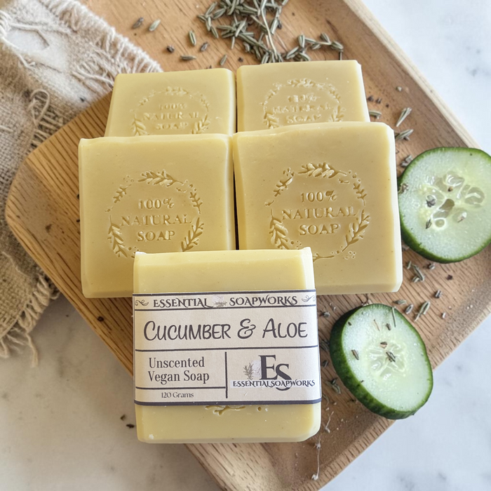 cucumber aloe soap on a wooden surface with cucumber slices