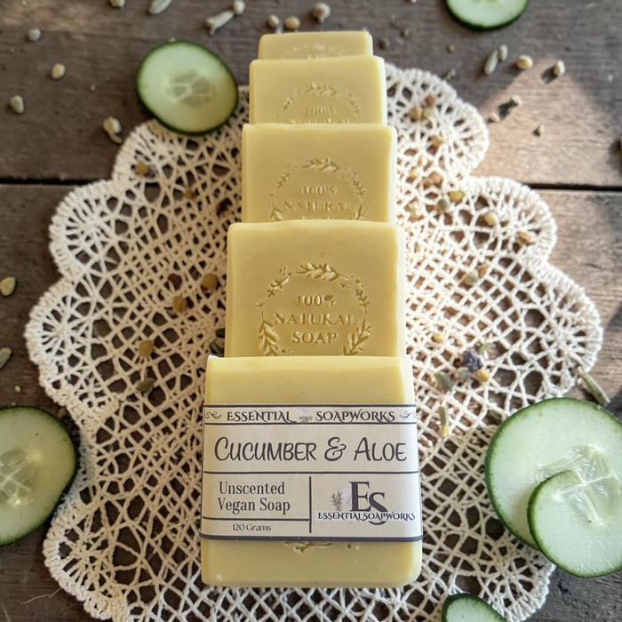 cucumber aloe soap on a wooden surface with cucumber slices