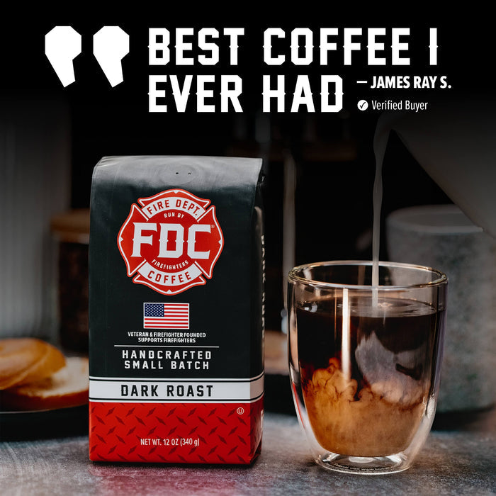 A bag of FDC Fire Department Coffee Dark Roast stands next to a clear glass cup with coffee being poured into it. Large promotional text at the top reads “BEST COFFEE I EVER HAD” with a quote attribution to James Ray S.