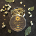 Divination loose incense with flowers and leaves on a dark surface