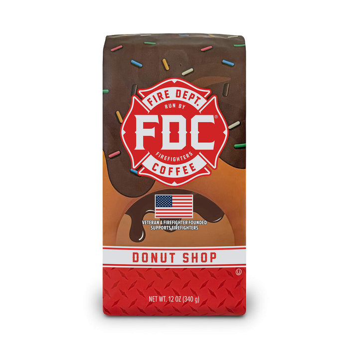 A 12 ounce package of Fire Department Coffee's Donut Shop Coffee on a white background.