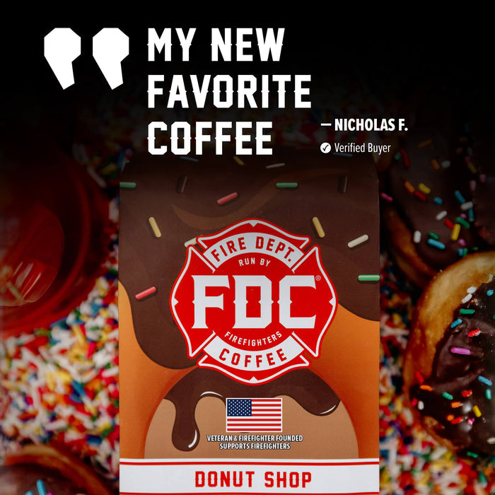A coffee donut shop package centered on a dark promotional graphic with the text 'MY NEW FAVORITE COFFEE' and a verified buyer badge. The package is brown with a red fire department emblem and sprinkles, surrounded by chocolate-covered donuts and colorful sprinkles.