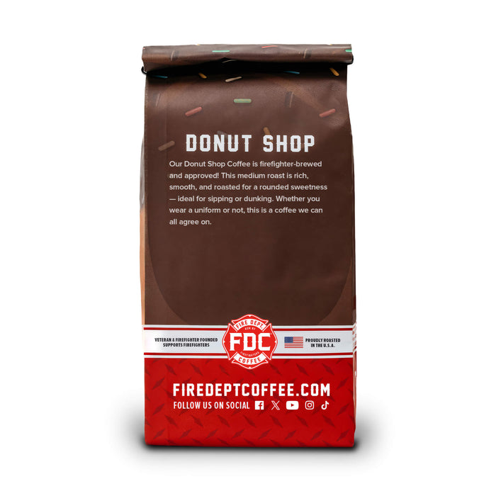 The back of a 12-ounce package of Fire Department Coffee's Donut Shop Coffee bag on a white background.