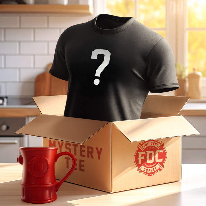 Black mystery t-shirt with a question mark in a cardboard Fire Department Coffee box labeled 'Mystery Tee'. Next to the box with the shirt inside is classic Fire Department Coffee Hydrant Mug.