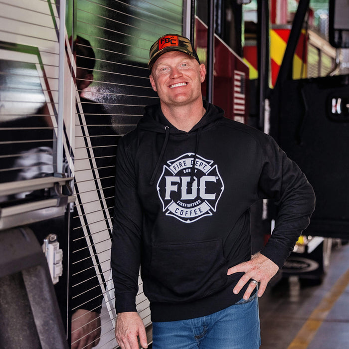 Jason wearing the Fire Department Coffee Black Hoodie and Camo Pike Pole Hat