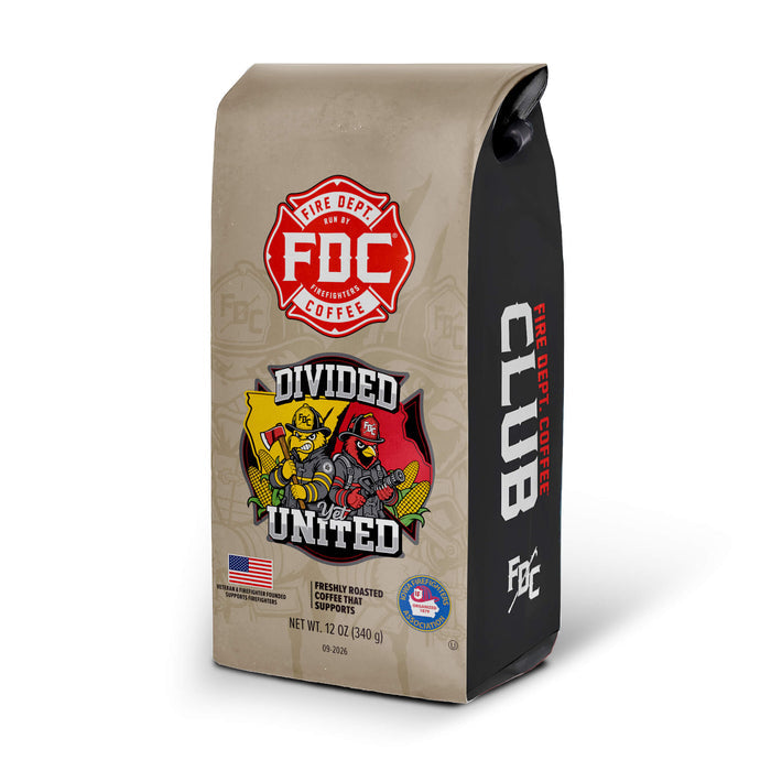 A 12 oz bag of FDC Club Fire Department Coffee, featuring a tan and black design with a red fire department logo and a 'Divided and United' graphic on the front, set against a plain white background.