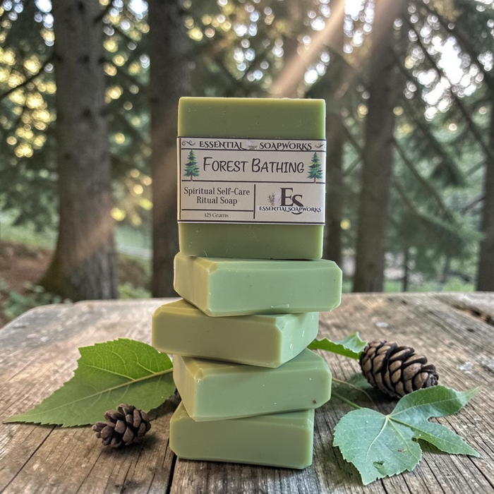 forest bathing ritual soap on a rustic wooden surface with trees in the background