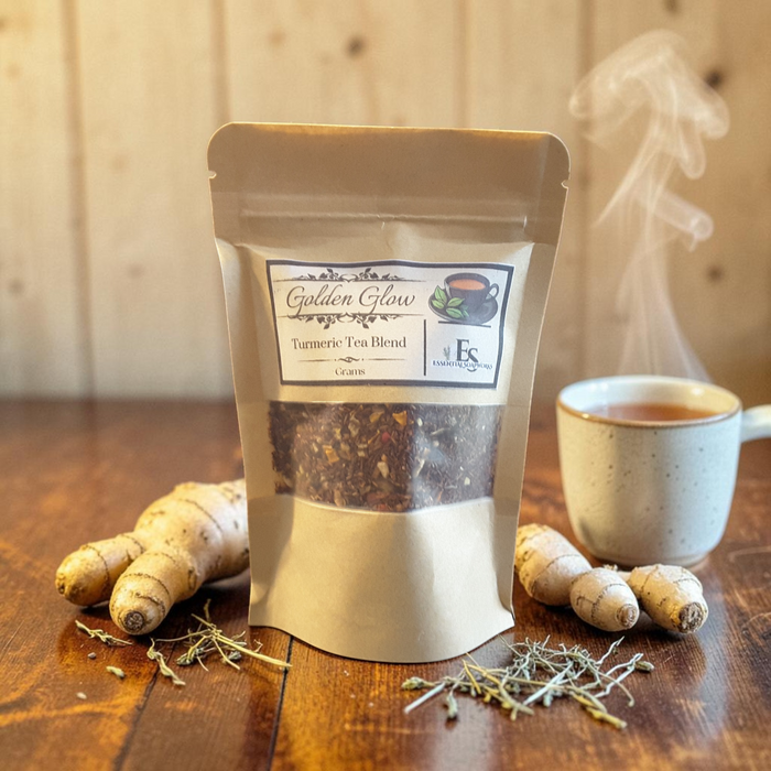 turmeric tea on a wooden surface with a teacup and turmeric root