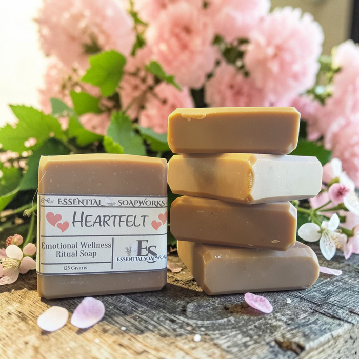 Heartfelt Emotional Wellness Soap on a wooden surface with pink flowers in the background