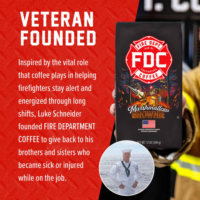 A bag of FDC Fire Department Coffee Marshmallown Brownie is held in front of a red and white promotional graphic. The graphic includes the text 'VETERAN FOUNDED,' a story about Luke Schneider, and a small circular photo of a sailor.