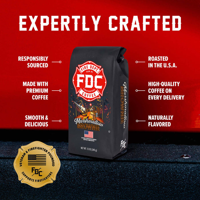 A bag of FDC Fire Department Coffee, Marshmallows and Smoke flavor, displayed against a red background with promotional text and a gold veteran firefighter seal.