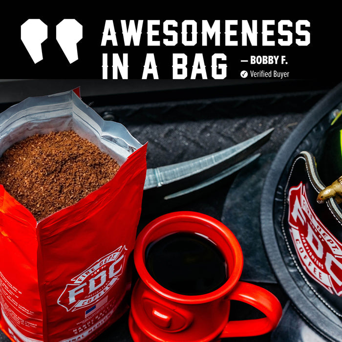 A red bag of FDC brand coffee sits open next to a red ceramic mug filled with black coffee, with a knife and a branded FDC hat in a dark setting. Large text at the top reads 'AWESOMENESS IN A BAG — BOBBY F.