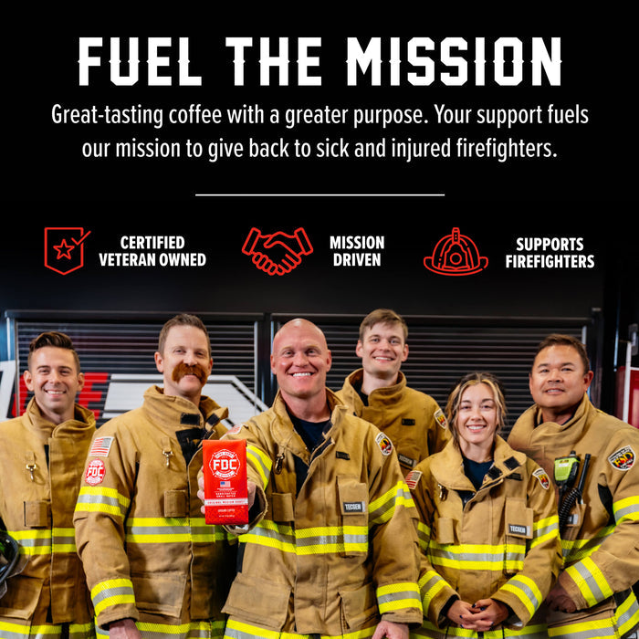 Six firefighters in tan turnout coats stand together in a fire station setting, with one person holding a red box labeled FFC. Above them is a black promotional banner with white and red text reading 'FUEL THE MISSION' and supporting callouts including 'Certified Veteran Owned,' 'Mission Driven,' and 'Supports Firefighters.