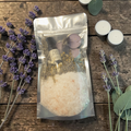 Peace & Calm Bath Ritual Kit with lavender, chamomile, tealight candles, ritual oil and amethyst crystal on a wooden background