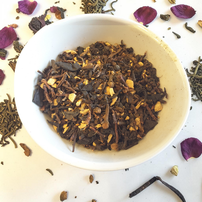 Protection loose leaf tea on a white background with scattered tea leaves and petals.