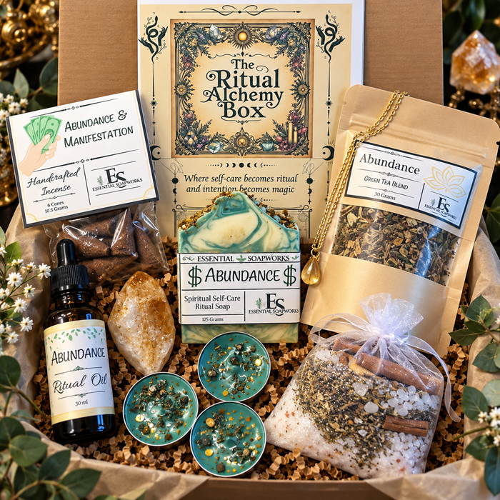 abundance ritual alchemy witchy subscription kit featuring ritual guide, botanical soap, loose leaf tea, ritual oil, incense, candles, crystals and jewelry