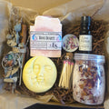Rose Quartz Crystal Ritual Kit with crystal soap, love potion oil, and other items on a beige background