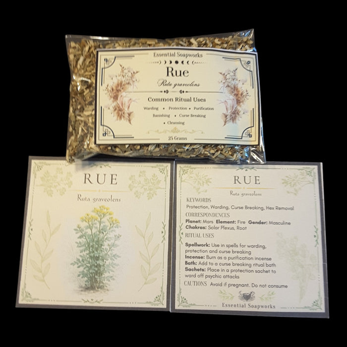 A package of Rue herb for witchcraft shown above two printed cards with botanical illustrations and text detailing its common ritual uses, set against a solid black background.