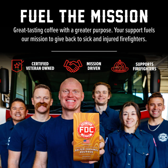 A group of smiling firefighters in navy uniforms stand in front of a fire truck, with one person holding a bag of FDC Firefighters Salted Caramel Bourbon coffee. The top of the image has a black banner with white text reading 'FUEL THE MISSION' and red icons for 'Certified Veteran Owned', 'Mission Driven', and 'Supports Firefighters'.