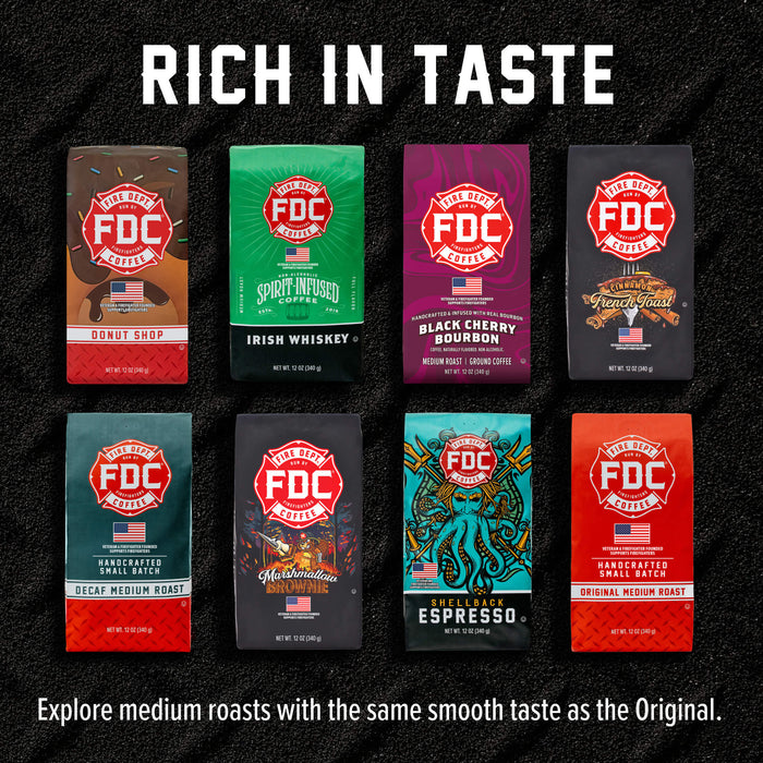 Eight bags of FDC Barrel Coffee Roasters arranged in a 2x4 grid on a black textured background, with the headline 'RICH IN TASTE' at the top and descriptive text at the bottom. The bags feature different color designs including brown, green, purple, black, teal, and red.