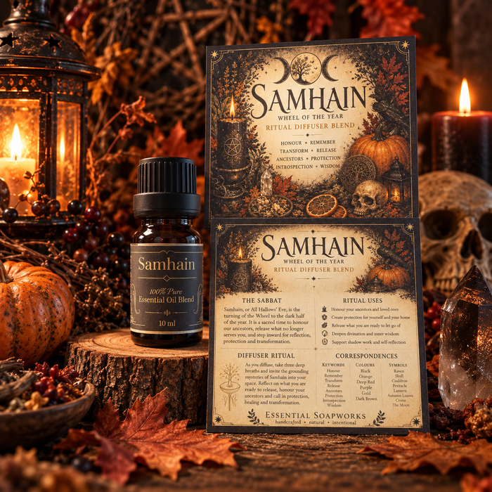 Samhain Ritual Diffuser Blend essential oil bottle and packaging cards displayed on a rustic wood slice with candles, autumn leaves, crystals, and a skull in the background.