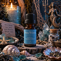 Sea Witch diffuser blend on a wooden surface surrounded by seashells with blue crystals, a mermaid statue and candles in the background