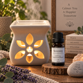 Serenity essential oil diffuser blend on a wooden surface alongside an essential oil burner