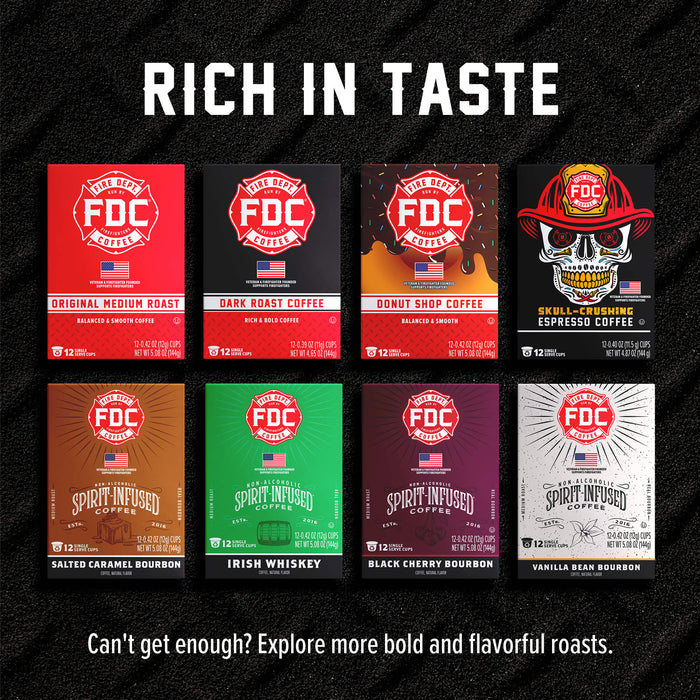 A promotional graphic for FDC Coffee Roasters showing eight different coffee roast boxes arranged in a 2x4 grid on a black textured background. The boxes feature various colors and illustrations, including a red Original Medium Roast, a dark gray Dark Roast, a red Donut Shop Coffee, a black Skull-Cruising Espresso, a brown Salted Caramel Bourbon, an Irish Whiskey green box, a black Cherry Bourbon purple box, and a white Vanilla Bean Bourbon box.