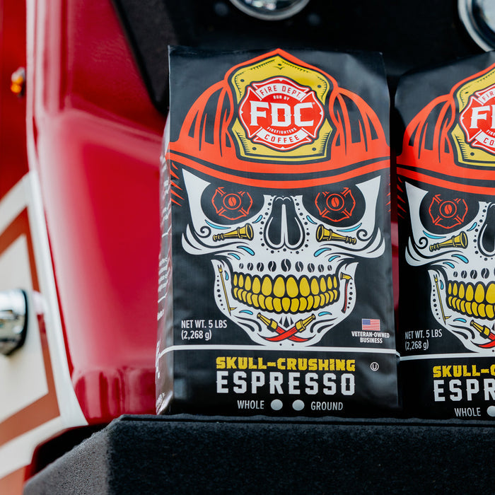 An image of two 5lb bags of Skull Crushing Espresso resting on a fire truck.