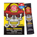 A box and single stick pack of FDC Fire Department Skull-Crushing Instant Espresso Coffee, featuring a graphic of a skull wearing a firefighter helmet on a yellow and black background.