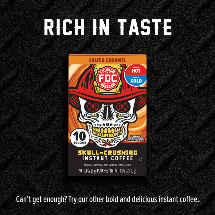FDC Premium Salted Caramel Skull-Crushing Instant Coffee pouch box centered on a black textured background with the text 'RICH IN TASTE' above and a tagline below.