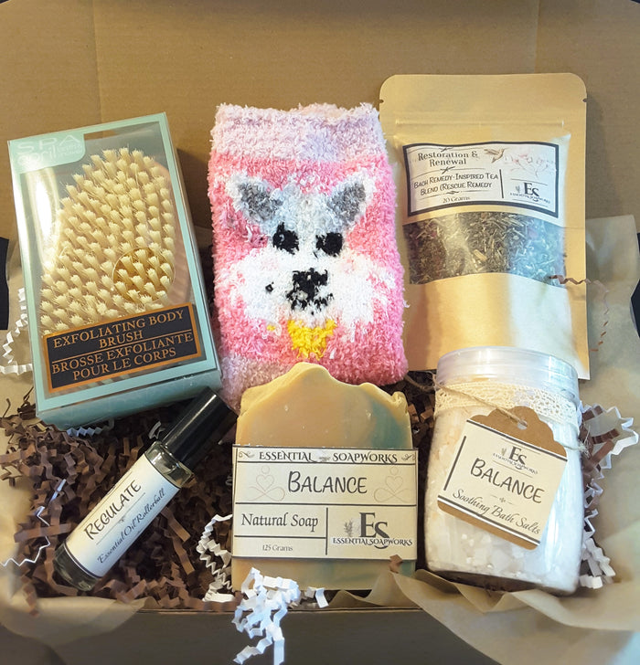Somatic Self-Care Ritual Kit featuring Balance Soap bar, herbal tea, essential oil rollerball, bath salts, exfoliating body brush and socks