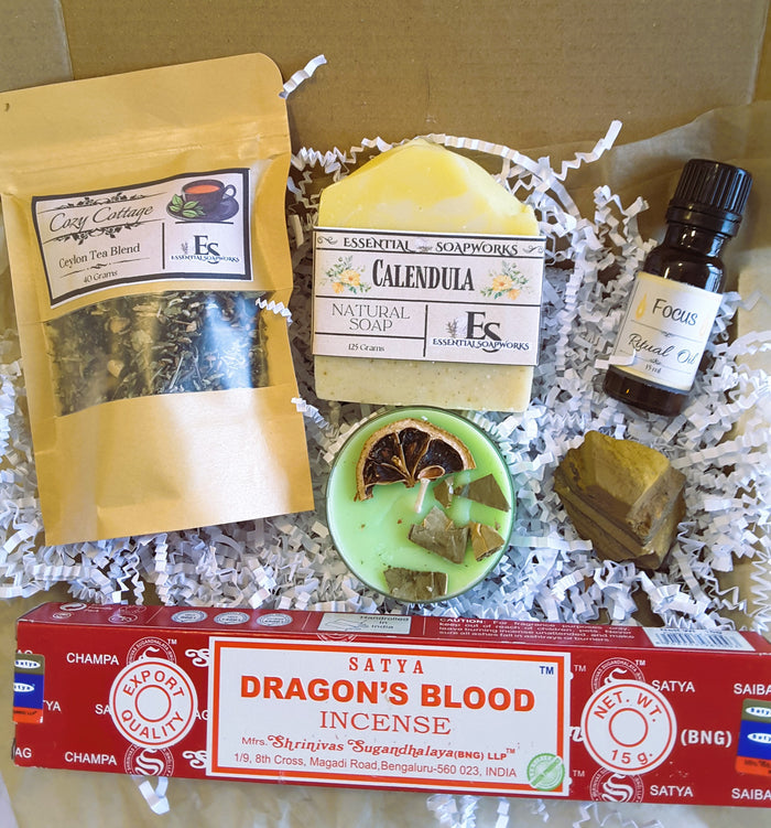 Spiritual Self-Care Mystery Kit including tea, soap, essential oil, and incense in a box.