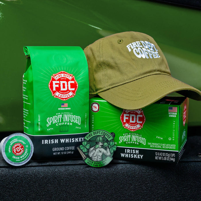 Green coffee packaging with 'FDC' logo and a cap on a dark surface.