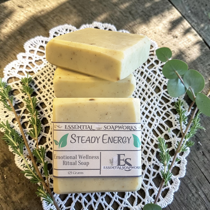 Steady Energy Emotional Wellness Soap on a wooden surface with greenery