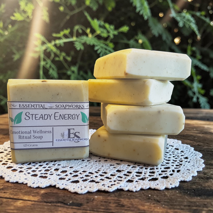 Steady Energy Emotional Wellness Soap on a wooden surface with greenery