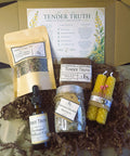 Tender Truth Emotional Balance Ritual Kit with soap, tea blend, essential oil, bath salts and candles in a box
