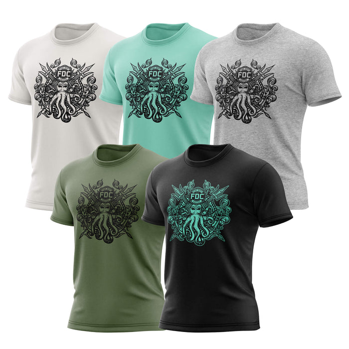 Five Fire Dept. Coffee T-shirts displayed on a white background in vintage white, mint, heather gray, military green, and black color options, each featuring a Shellback-inspired graphic with an FDC logo and octopus design on the front