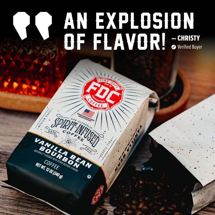 A package of FDC Vanilla Bean Bourbon coffee lies on a wooden surface with coffee beans scattered around it. A second open bag is partly visible beside it, and a large promotional text banner at the top reads 'AN EXPLOSION OF FLAVOR! - CHRISTY Verified Buyer'.