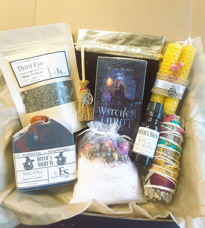 Cozy witch self-care ritual kit with items like tea, tarot cards, and crystals.