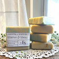 Worthy & Whole Emotional Wellness Soap on a wooden surface with decorative elements.